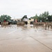 Soldiers of the 25th Transportation Battalion stand in formation for the Change of Command Ceremony at their motor pool.