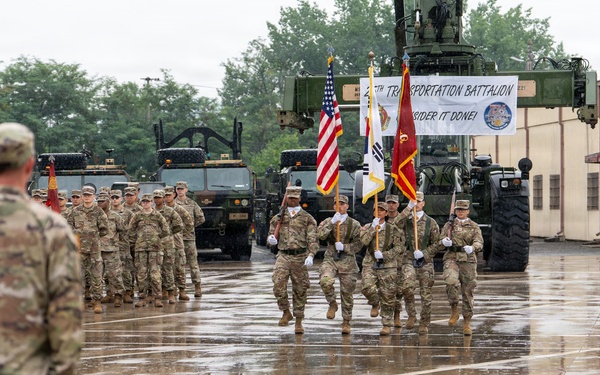Color Guard members march off during the 25th Transportation Battalion Change of Command Ceremony.