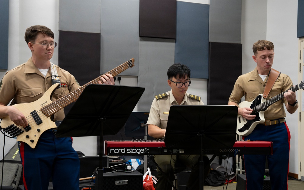 U.S. Marine band practices alongside the Singapore Armed Forces Band