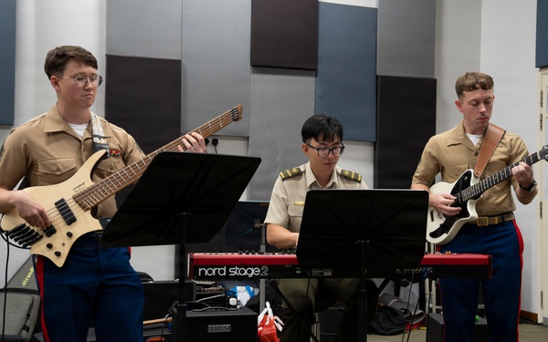 U.S. Marine band practices alongside the Singapore Armed Forces Band