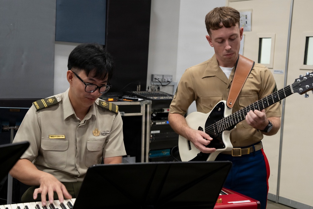 U.S. Marine band practices alongside the Singapore Armed Forces Band