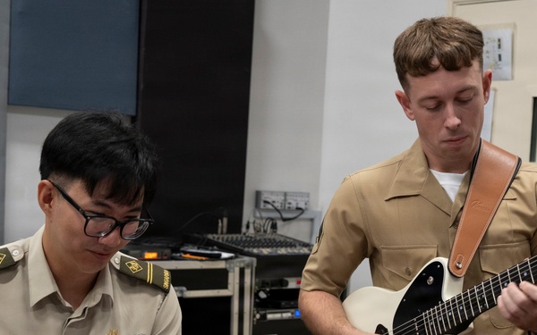 U.S. Marine band practices alongside the Singapore Armed Forces Band