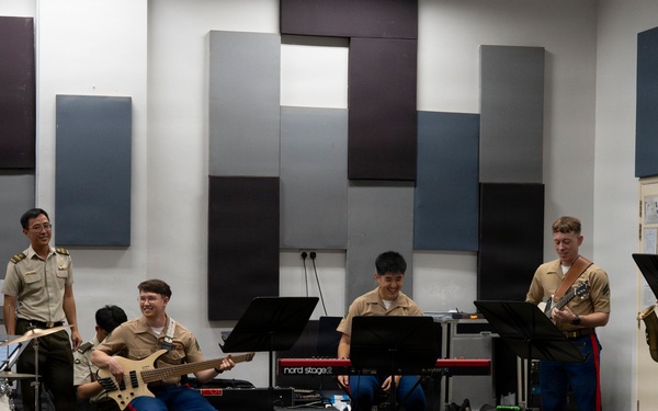 U.S. Marine band practices alongside the Singapore Armed Forces Band