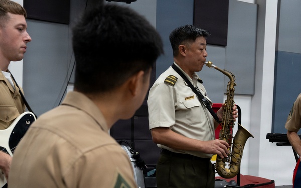 U.S. Marine band practices alongside the Singapore Armed Forces Band
