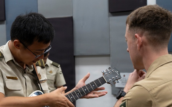 U.S. Marine band practices alongside the Singapore Armed Forces Band