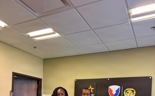 Ebonie McClintock-Bennett with her 15-year service certificate