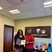Ebonie McClintock-Bennett with her 15-year service certificate