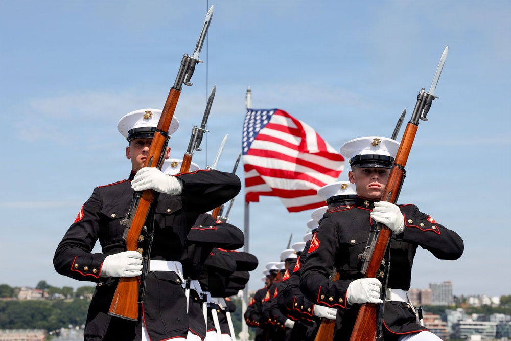 U.S. Marine Corps Silent Drill Platoon performs on the USS Arlington