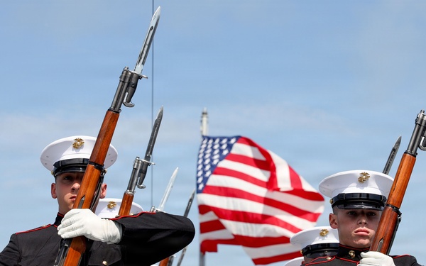 U.S. Marine Corps Silent Drill Platoon performs on the USS Arlington