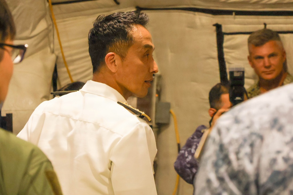 Japan Maritime Self Defense Force personnel tour the RIMPAC 2026 humanitarian assistance and disaster relief camp