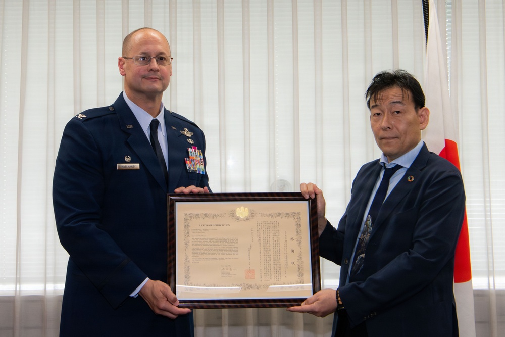 374th AW commander visits local leaders