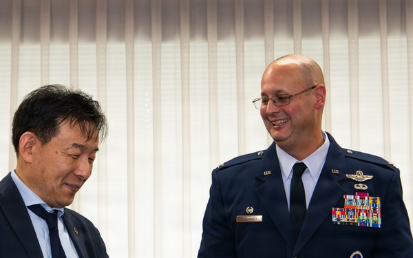 374th AW commander visits local leaders