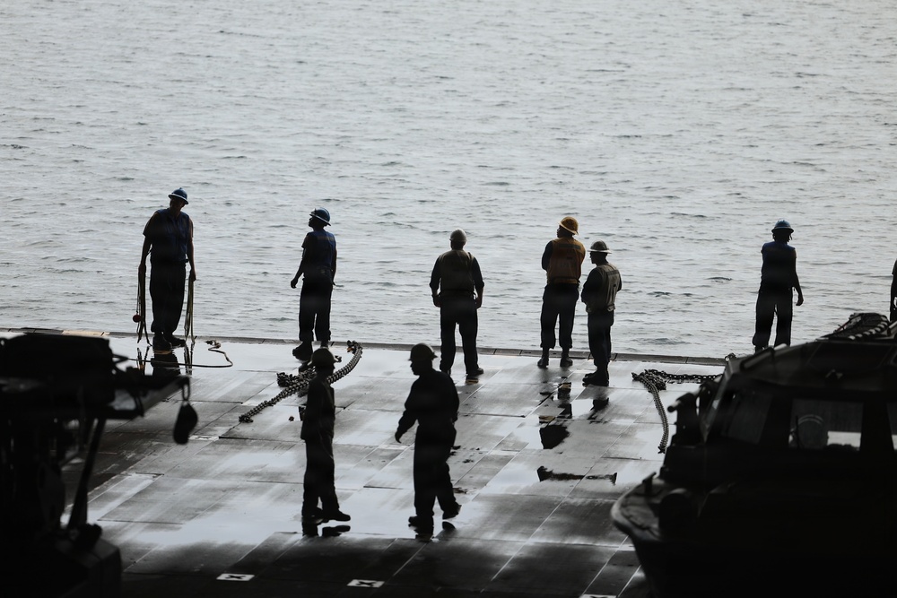 U.S. Sailors prepare for a landing craft, utility to approach the well deck of the San Antonio-class amphibious transport dock USS Fort Lauderdale (LPD 28), at the port of La Guaira, Venezuela, July 6, 2026.