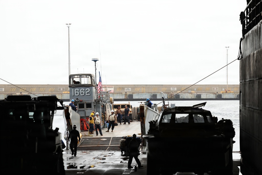 A landing craft, utility approaches the well deck of the San Antonio-class amphibious transport dock USS Fort Lauderdale (LPD 28), at the port of La Guaira, Venezuela, July 6, 2026.