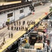 U.S. Marines, with 3rd Battalion, 2nd Marine Regiment, Littoral Combat Force-24, and U.S. Sailors, with San Antonio-class amphibious transport dock USS Fort Lauderdale (LPD 28), load supplies.