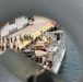 U.S. Marines, with 3rd Battalion, 2nd Marine Regiment, Littoral Combat Force-24, and U.S. Sailors, with San Antonio-class amphibious transport dock USS Fort Lauderdale (LPD 28), load supplies.