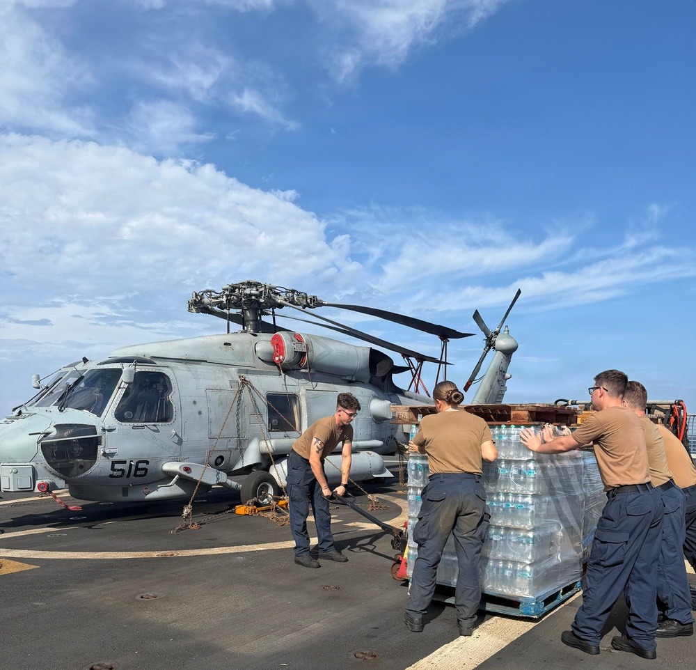 U.S. Navy Sailors stage water donated by the Netherlands for transfer aboard the littoral combat ship USS Billings (LCS 15) while underway off the coast of Venezuela, July 2, 2026.