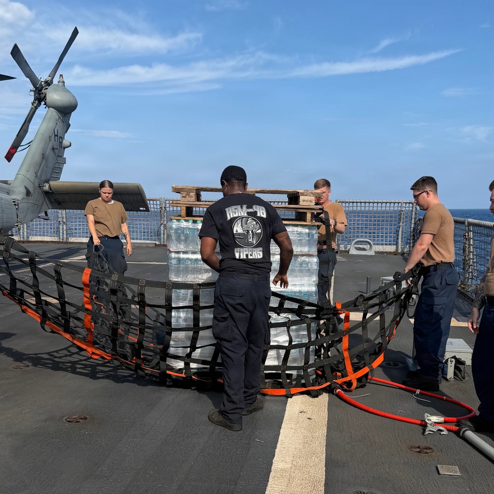 U.S. Navy Sailors stage water donated by the Netherlands for transfer aboard the littoral combat ship USS Billings (LCS 15) while underway off the coast of Venezuela, July 2, 2026.