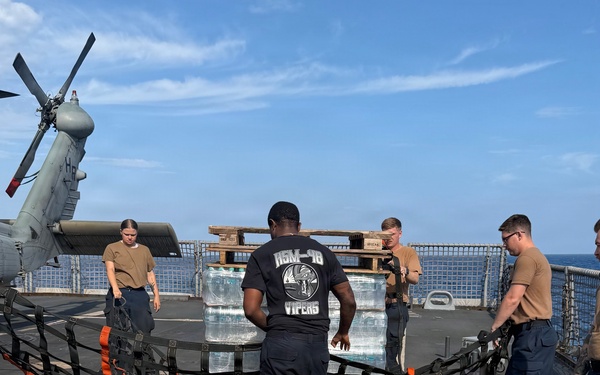 U.S. Navy Sailors stage water donated by the Netherlands for transfer aboard the littoral combat ship USS Billings (LCS 15) while underway off the coast of Venezuela, July 2, 2026.