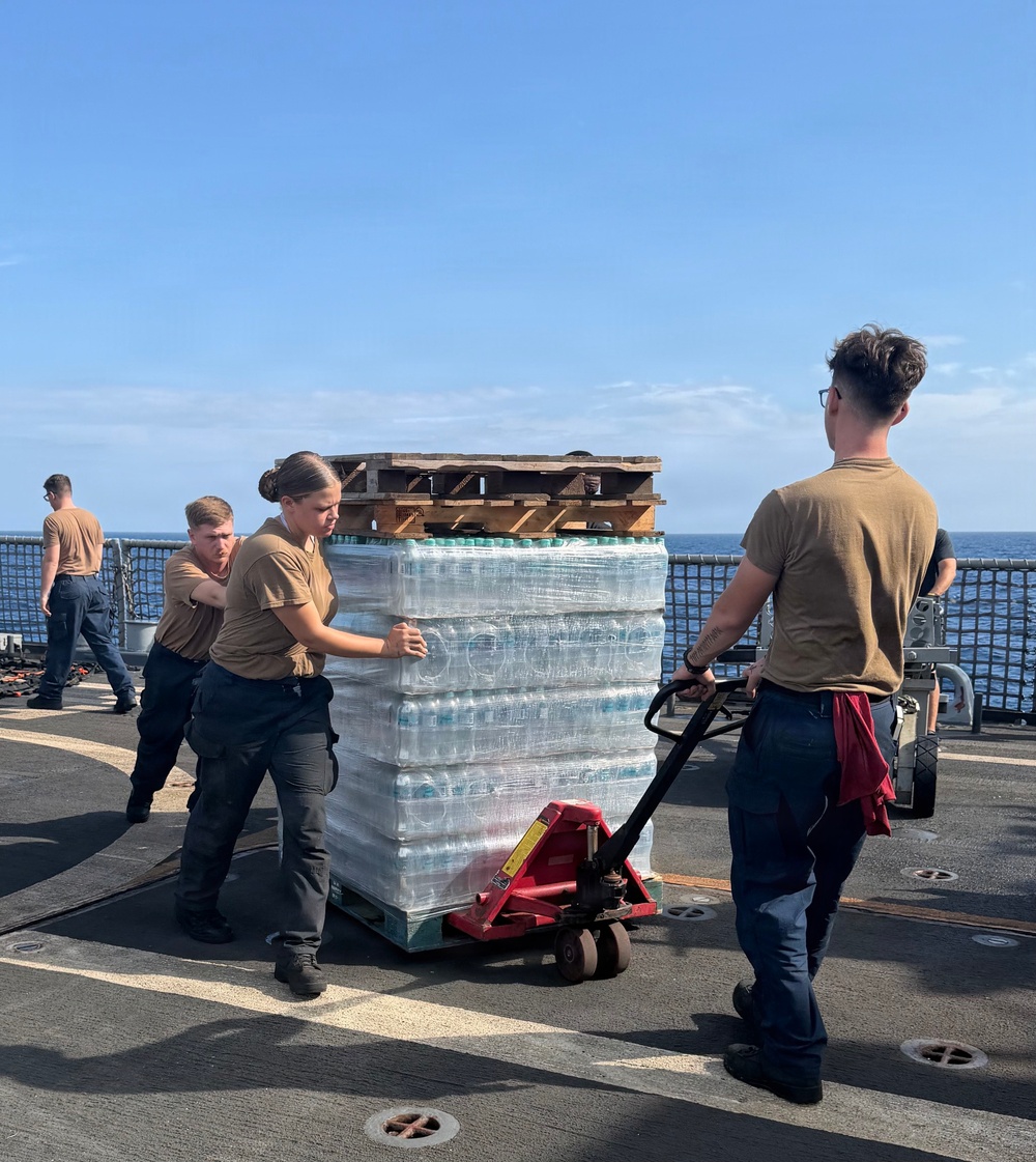 U.S. Navy Sailors stage water donated by the Netherlands for transfer aboard the littoral combat ship USS Billings (LCS 15) while underway off the coast of Venezuela, July 2, 2026.