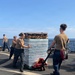 U.S. Navy Sailors stage water donated by the Netherlands for transfer aboard the littoral combat ship USS Billings (LCS 15) while underway off the coast of Venezuela, July 2, 2026.