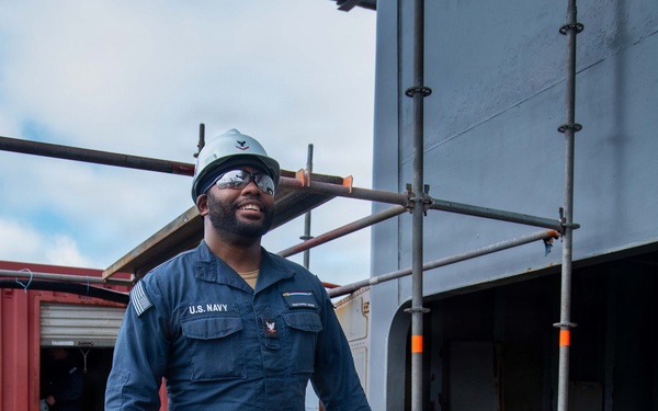 Sailors Moving Canisters