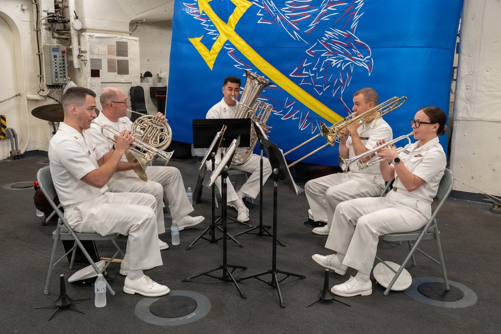 U.S. Navy Band Brass Quintet perform at the International Naval Review Closing Ceremony