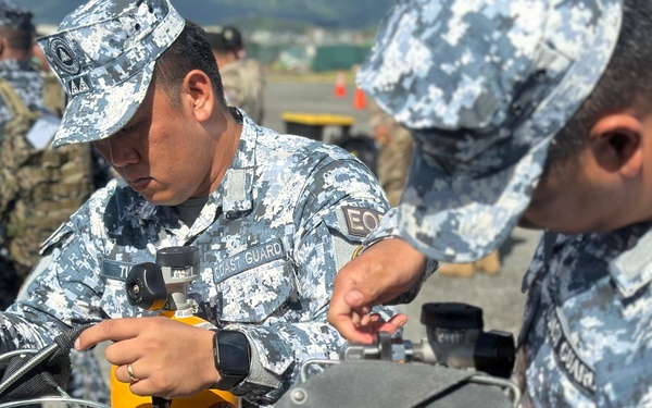 Multinational forces participate in a CBRN response exercise during RIMPAC 2026 HADR training