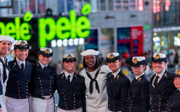 U.S. Sailors pose with Royal British Navy Sailors in Times Square in New York