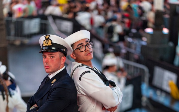 U.S. Sailor and Royal British Navy Sailor pose in Times Square in New York