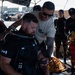 Multinational Clearance Divers conduct a wreck access cutting dive during RIMPAC 2026