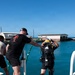 Multinational Clearance Divers conduct a wreck access cutting dive during RIMPAC 2026