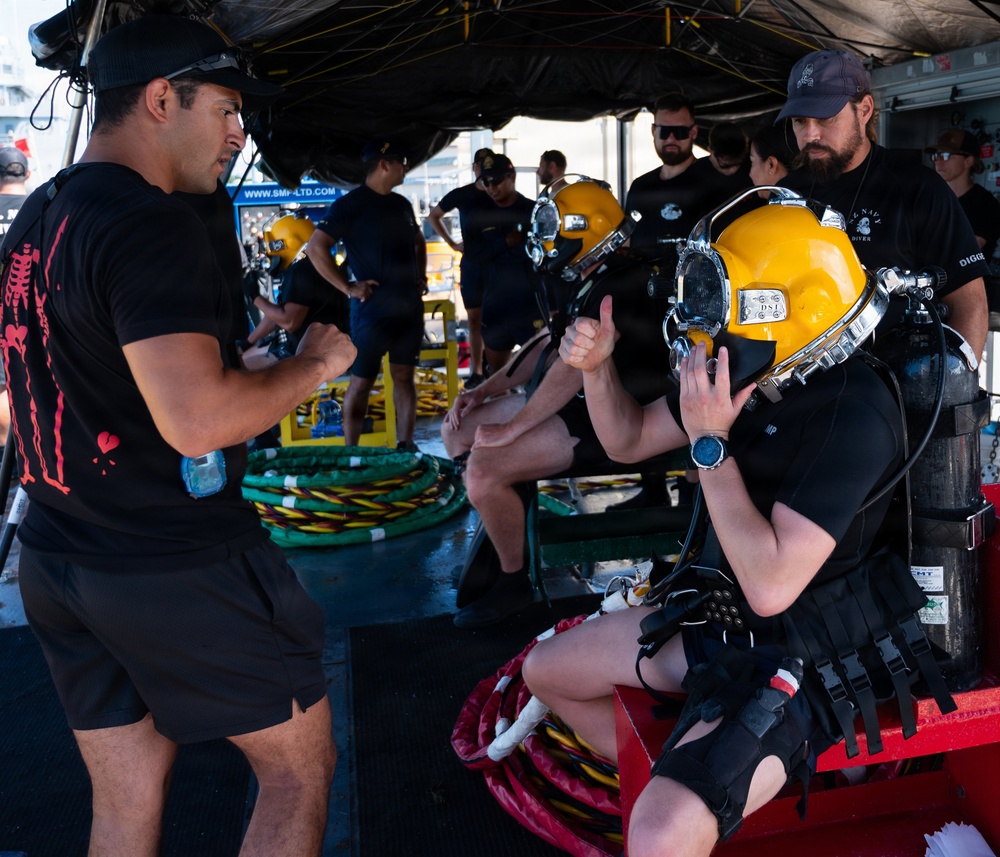 Multinational Clearance Divers conduct a wreck access cutting dive during RIMPAC 2026