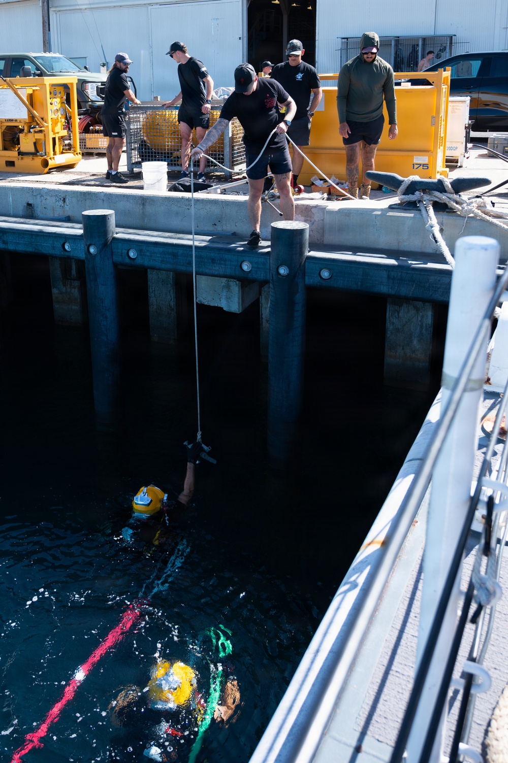 Multinational Clearance Divers conduct a wreck access cutting dive during RIMPAC 2026
