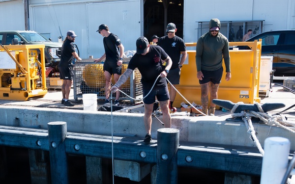 Multinational Clearance Divers conduct a wreck access cutting dive during RIMPAC 2026