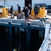 Multinational Clearance Divers conduct a wreck access cutting dive during RIMPAC 2026