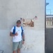 U.S. Army Capt. Javier Pino, with U.S. Army Veterinary Readiness Activity, Rheinland-Pfalz, poses beside a plaque honoring Col. William O. Darby.
