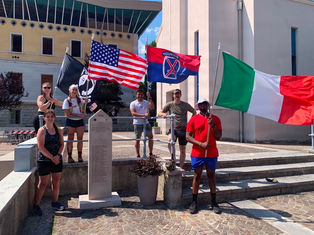 Soldiers from U.S. Army Veterinary Readiness Activity, Rheinland-Pfalz and an Airman from the 52nd Fighter Wing posing for a group photo after completing the Darby 40-Mile Challenge in Torbole, Italy.