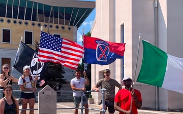 Soldiers from U.S. Army Veterinary Readiness Activity, Rheinland-Pfalz and an Airman from the 52nd Fighter Wing posing for a group photo after completing the Darby 40-Mile Challenge in Torbole, Italy.