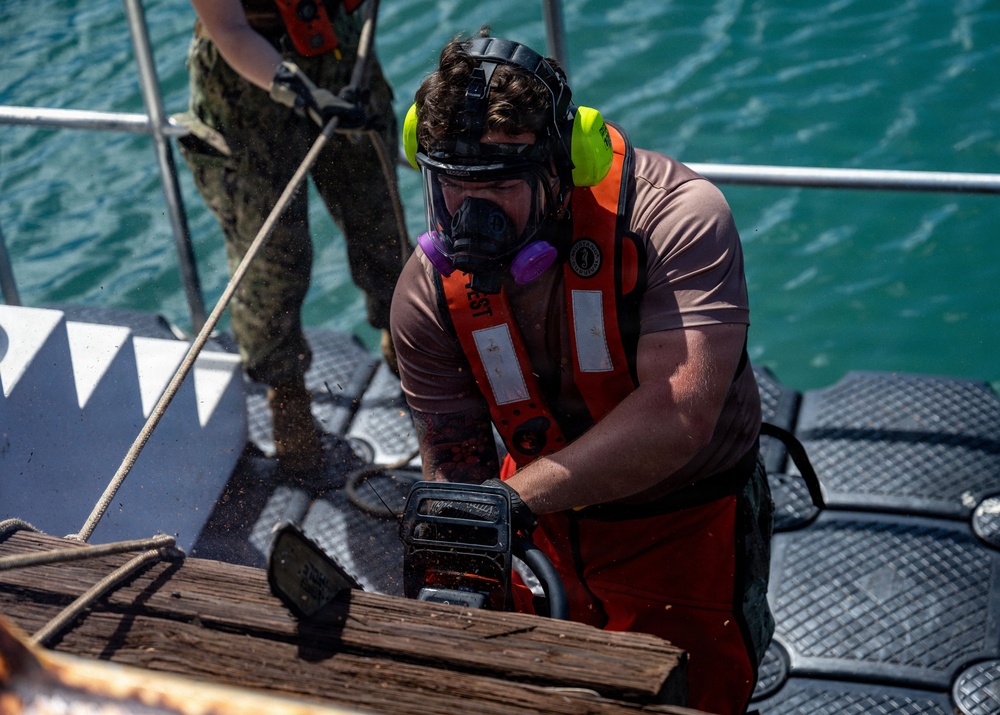 UCT 2 and NMCB 3 WCC conduct pier repairs at Joint Base Pearl Harbor-Hickam