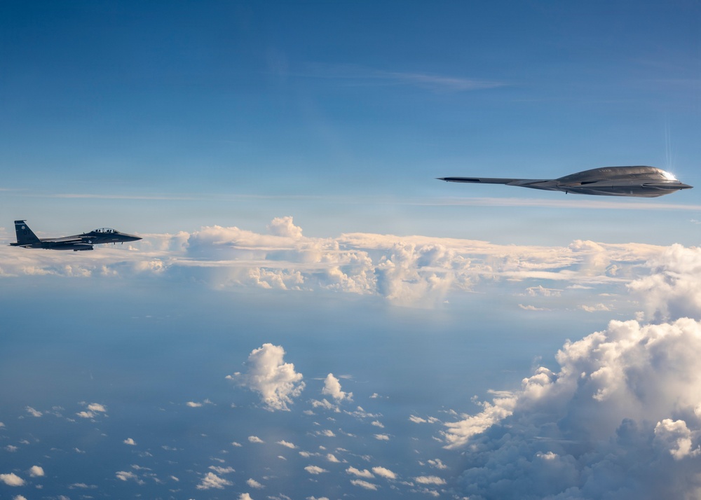 B-2 Stealth Bomber and an F-15E Strike Eagle participate in a live-fire sinking exercise as part of Valiant Shield 2026