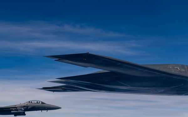 B-2 Stealth Bomber and an F-15E Strike Eagle participate in a live-fire sinking exercise as part of Valiant Shield 2026