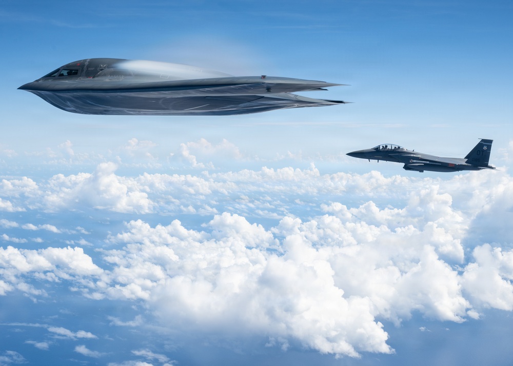 B-2 Stealth Bomber and an F-15E Strike Eagle participate in a live-fire sinking exercise as part of Valiant Shield 2026