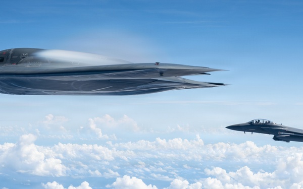 B-2 Stealth Bomber and an F-15E Strike Eagle participate in a live-fire sinking exercise as part of Valiant Shield 2026