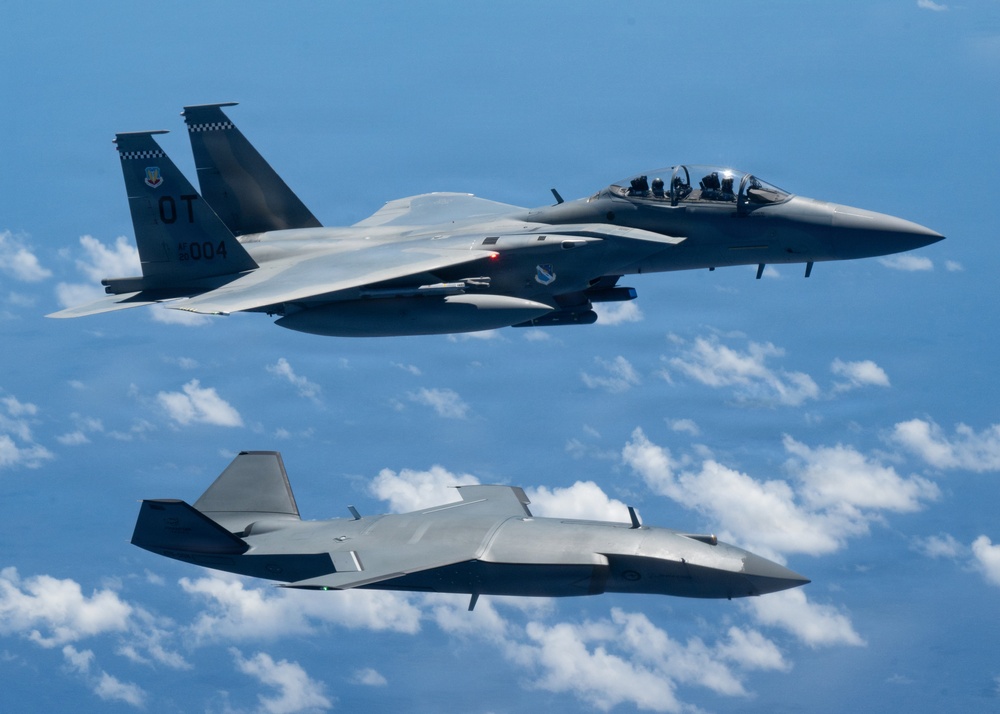 An MQ-28 Ghost Bat from Boeing Defense Australia and a U.S. Air Force F-15EX Eagle II participate in Valiant Shield 2026