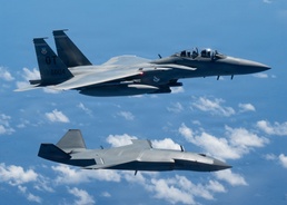 An MQ-28 Ghost Bat from Boeing Defense Australia and a U.S. Air Force F-15EX Eagle II participate in Valiant Shield 2026
