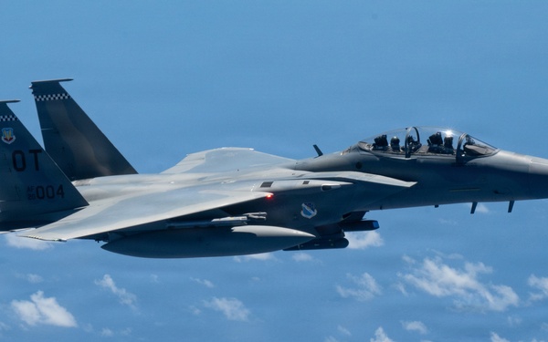 An MQ-28 Ghost Bat from Boeing Defense Australia and a U.S. Air Force F-15EX Eagle II participate in Valiant Shield 2026
