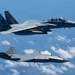 An MQ-28 Ghost Bat from Boeing Defense Australia and a U.S. Air Force F-15EX Eagle II participate in Valiant Shield 2026