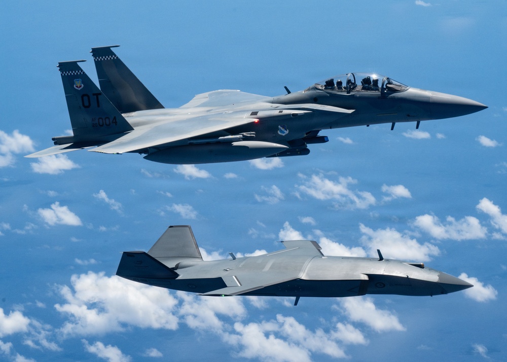 An MQ-28 Ghost Bat from Boeing Defense Australia and a U.S. Air Force F-15EX Eagle II participate in Valiant Shield 2026
