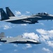 An MQ-28 Ghost Bat from Boeing Defense Australia and a U.S. Air Force F-15EX Eagle II participate in Valiant Shield 2026